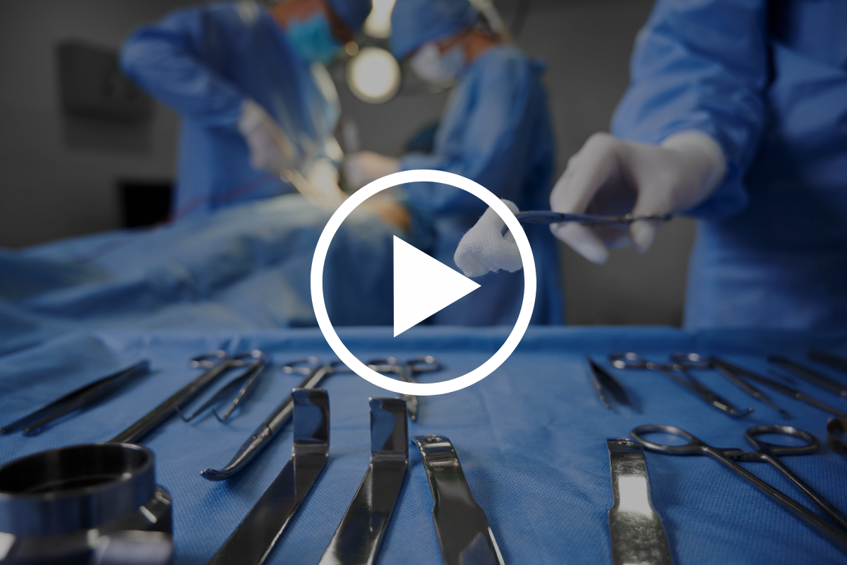 doctors operating on patient closeup of surgical tools